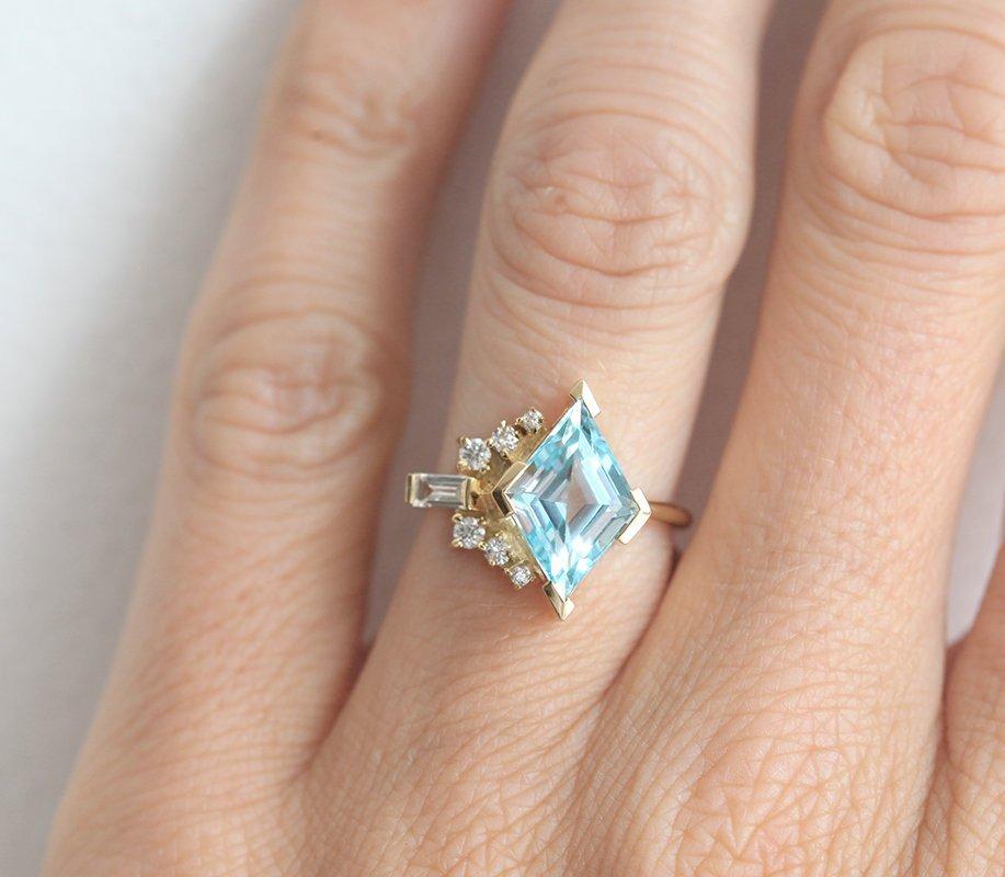 Kite Aquamarine Cluster Ring with Side Round Diamonds and one Baguette White Diamond