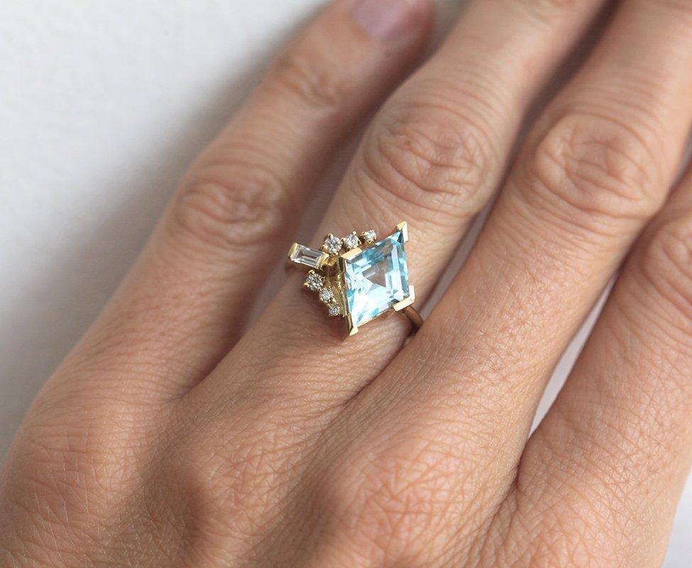 Kite Aquamarine Cluster Ring with Side Round Diamonds and one Baguette White Diamond