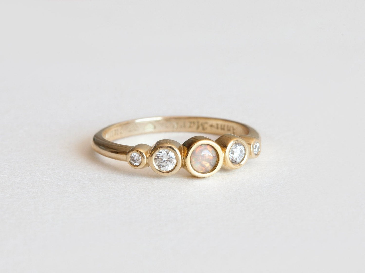Round Opal Ring with Round White Symmetrically Placed Diamonds