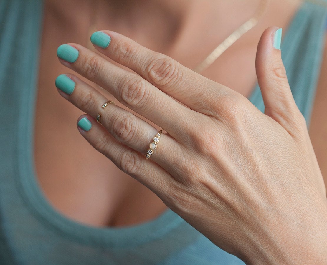 Round Opal Ring with Round White Symmetrically Placed Diamonds