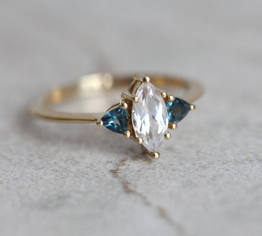 Prsten od belog safira rezane marke markiz sa dragim kamenjem topaza