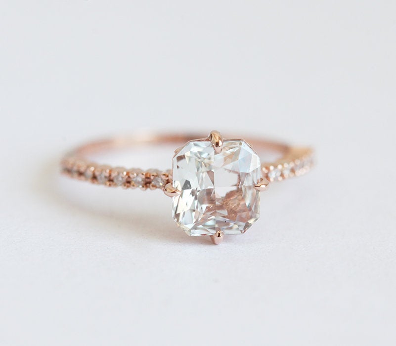 Radiant white sapphire ring with side diamonds