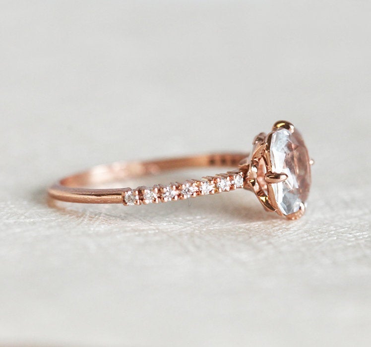 Radiant white sapphire ring with side diamonds