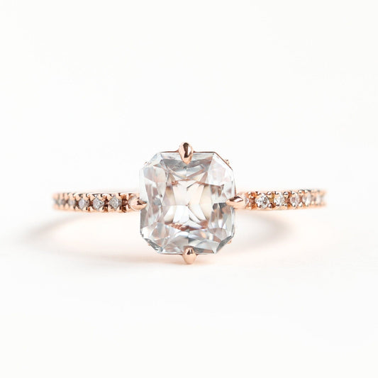 Radiant white sapphire ring with side diamonds