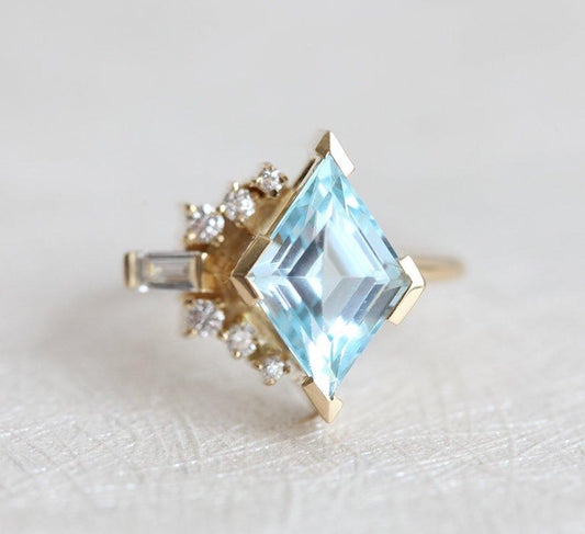 Kite Aquamarine Cluster Ring with Side Round Diamonds and one Baguette White Diamond