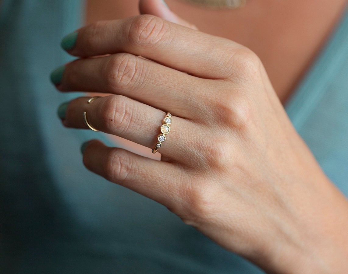 Round Opal Ring with Round White Symmetrically Placed Diamonds